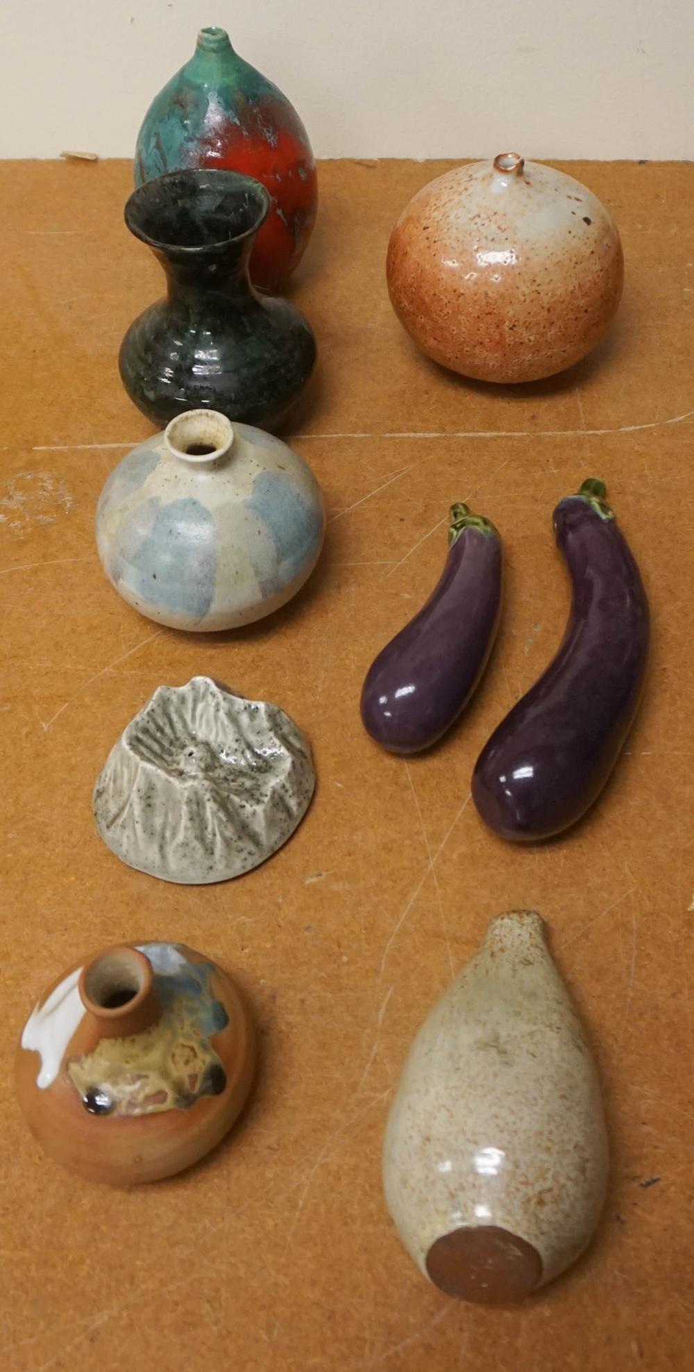 COLLECTION OF NINE CERAMIC TABLE