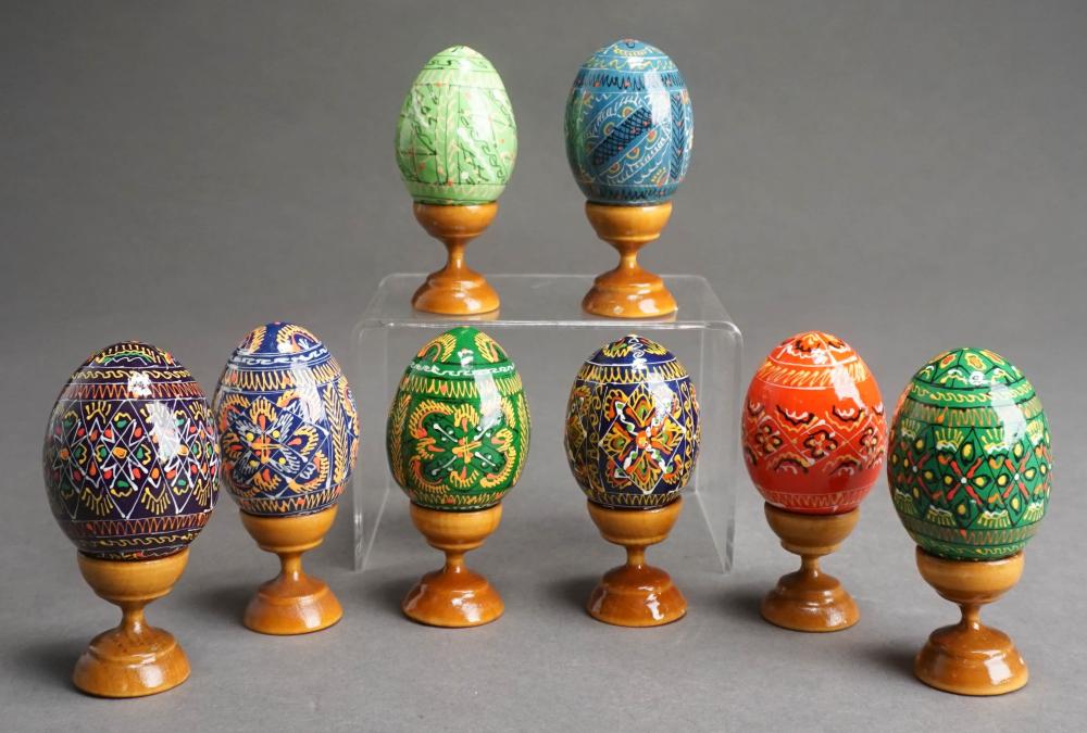 EIGHT HAND PAINTED WOOD EGGS ON