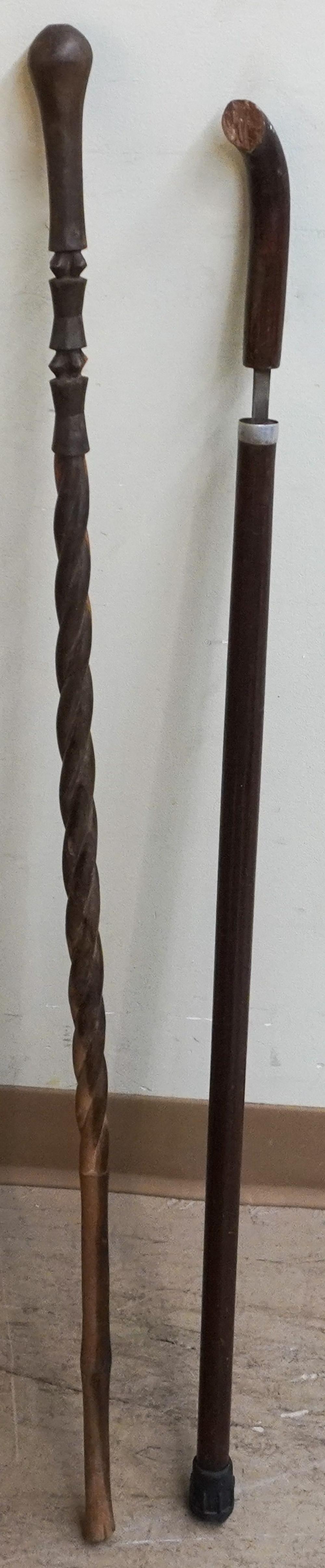 TWO CARVED WOOD CANES, ONE WITH