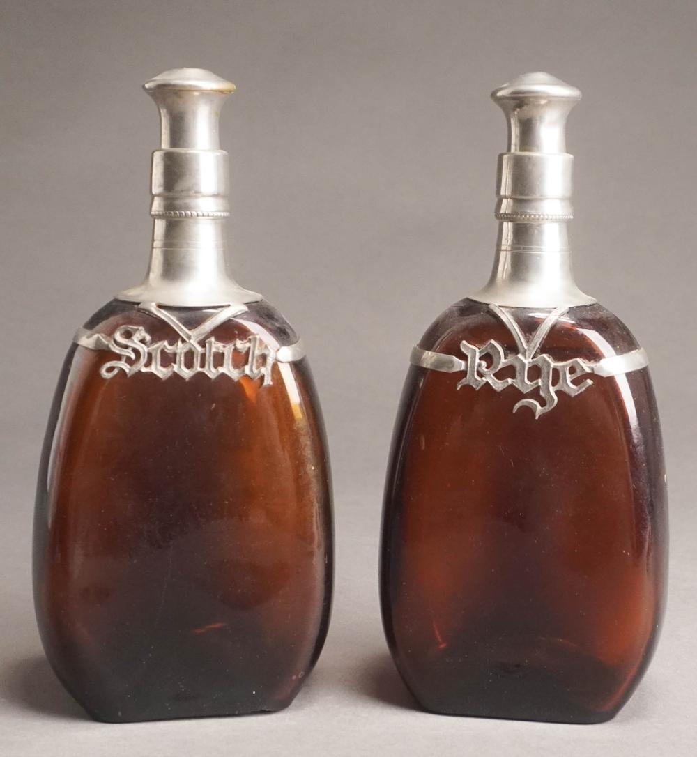 PAIR OF PEWTER MOUNTED AMBER GLASS