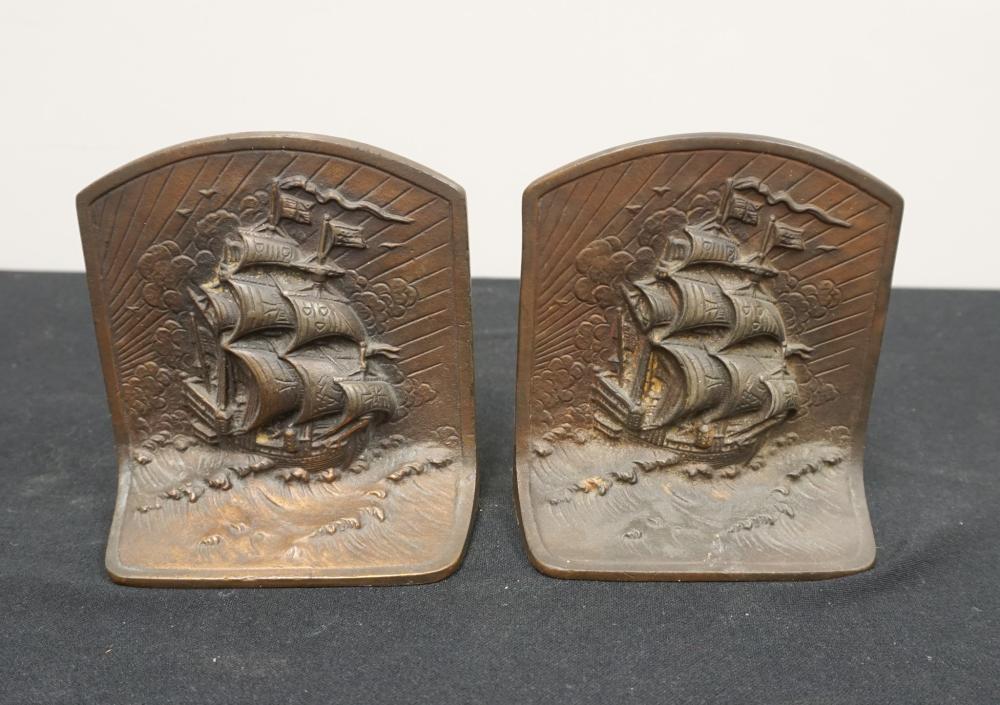 PAIR OF PATINATED IRON SHIPS AT