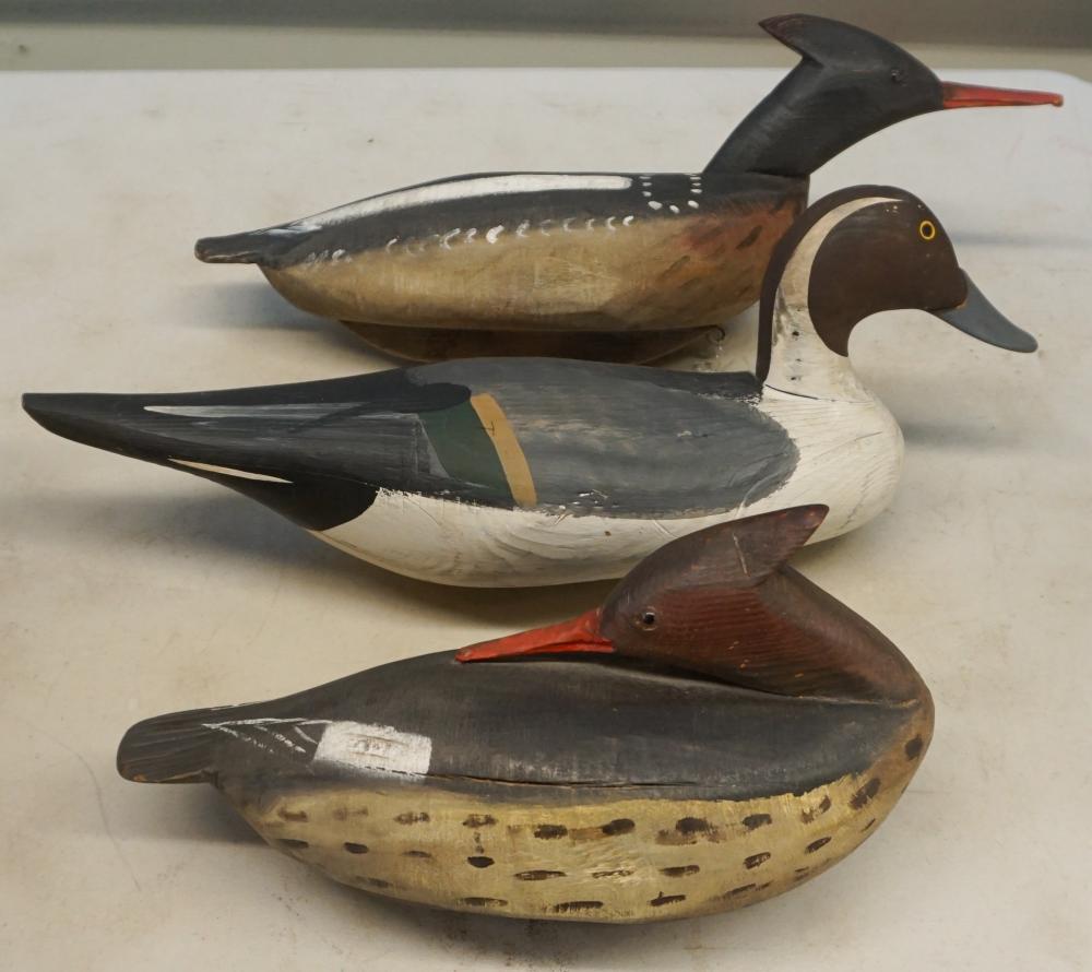 THREE PAINTED WOOD DUCK DECOYSThree