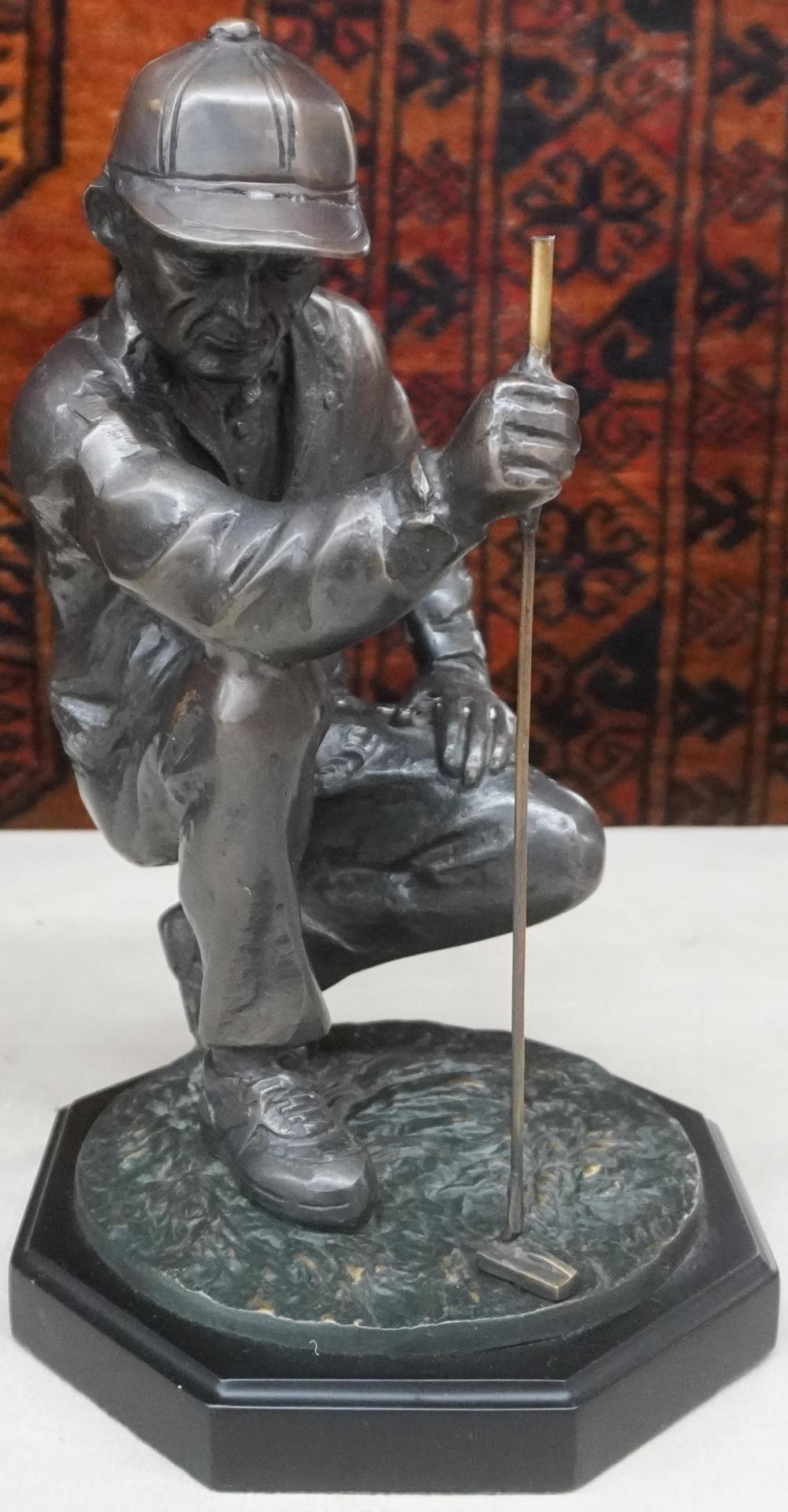 PATINATED METAL FIGURE OF A GOLFER,