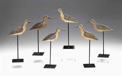 Seven carved and painted yellowlegs