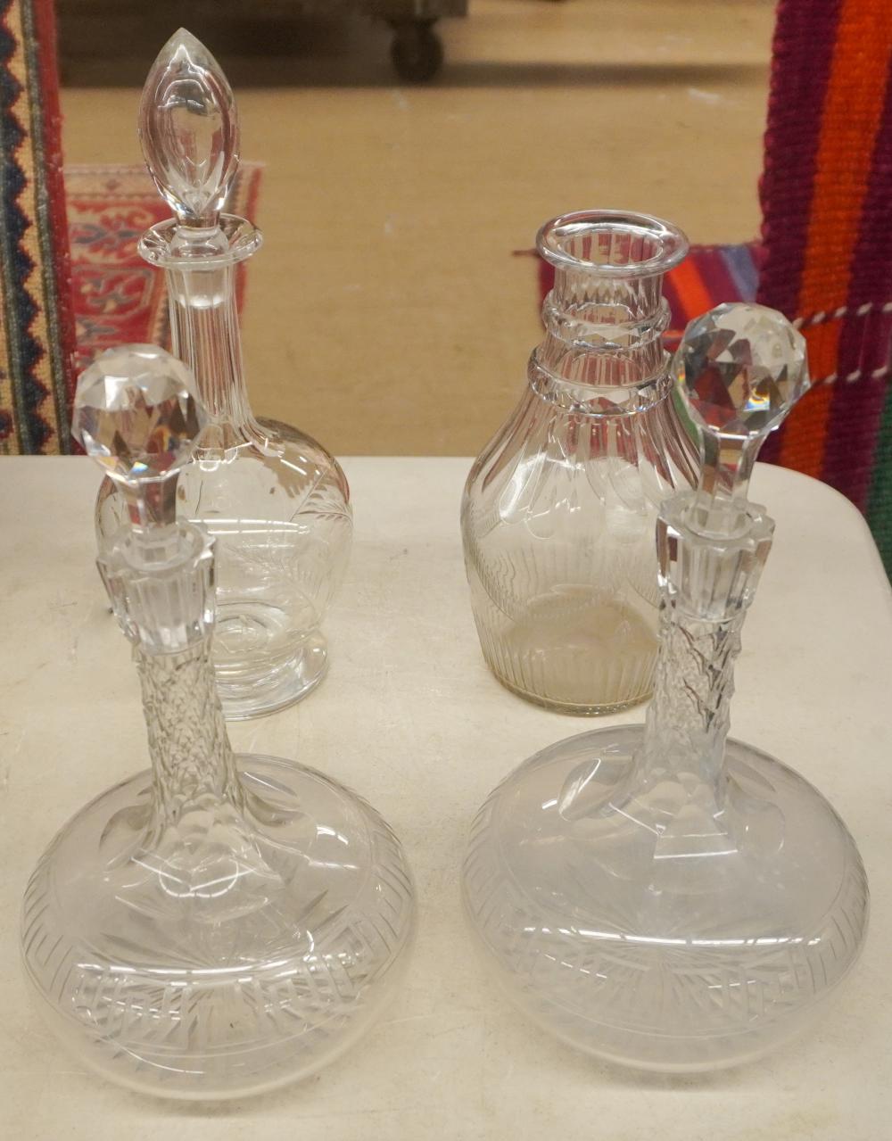 FOUR ANGLO-IRISH CUT-CRYSTAL DECANTERS,