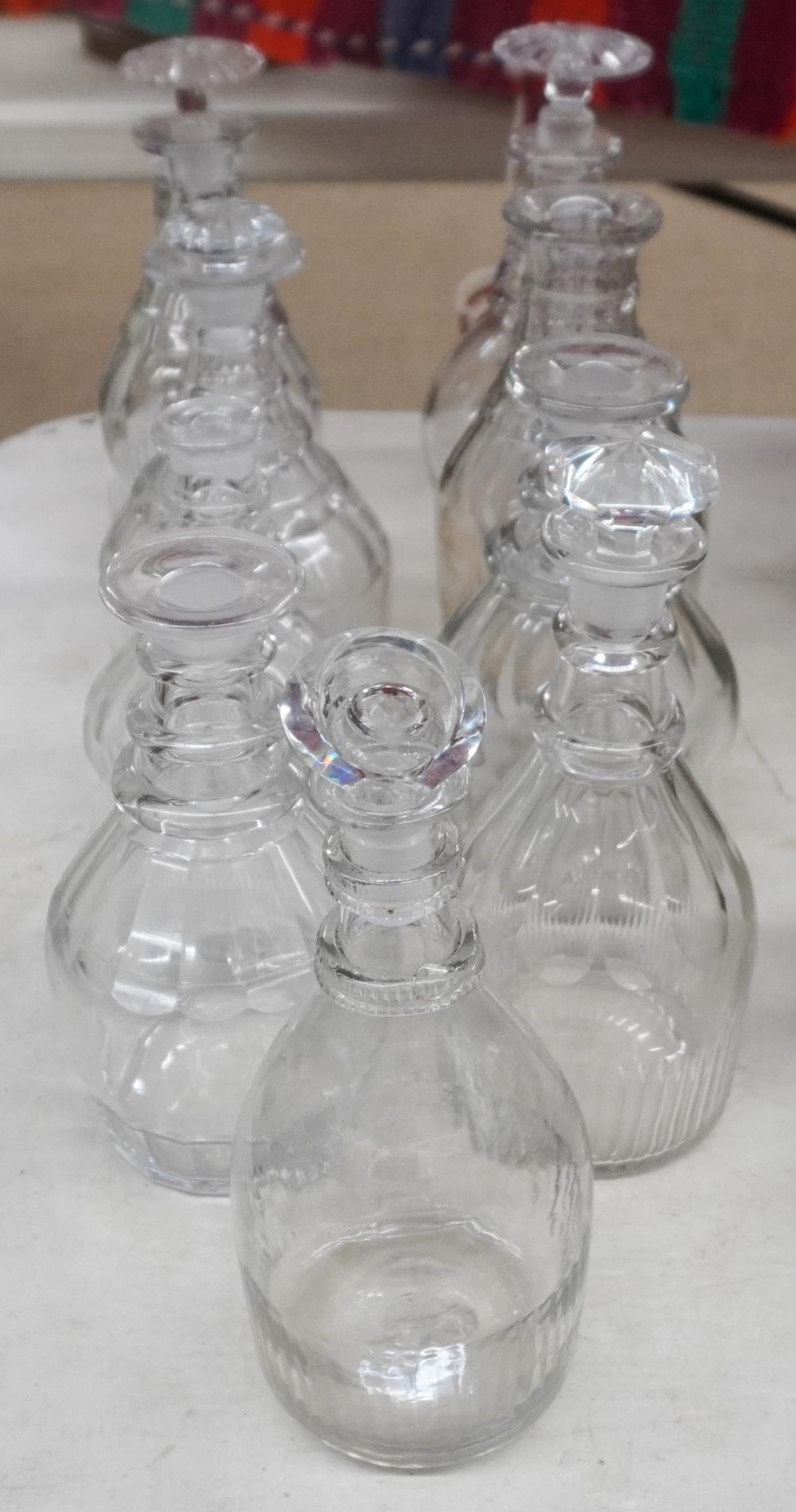 NINE ANGLO-IRISH CUT-CRYSTAL DECANTERS,