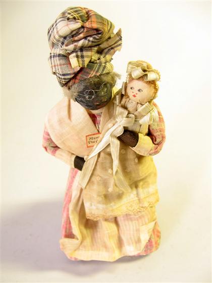 A handmade mammy doll with baby