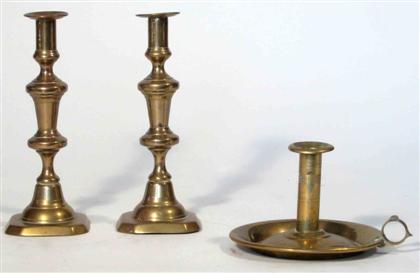 One pair and one single brass chamberstick