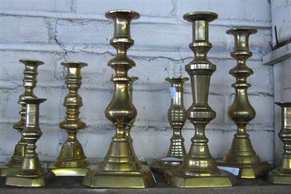 Group of 24 brass candlesticks