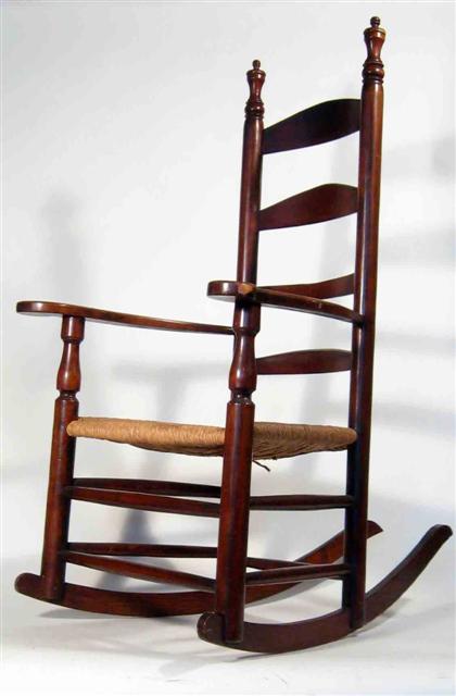 Ladder back rocking arm chair with