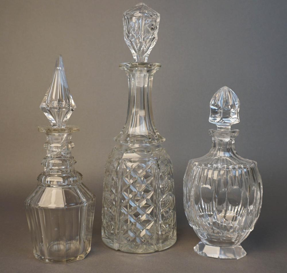 THREE GLASS/CRYSTAL DECANTERS,