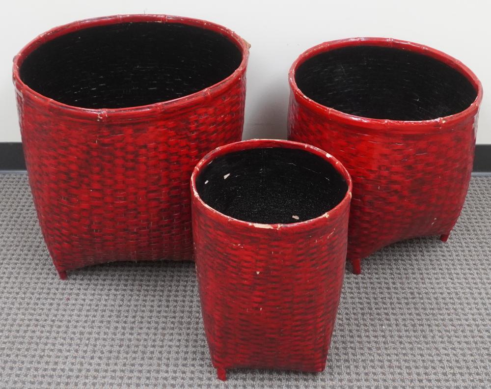 THREE RED PAINTED BAMBOO BASKETS