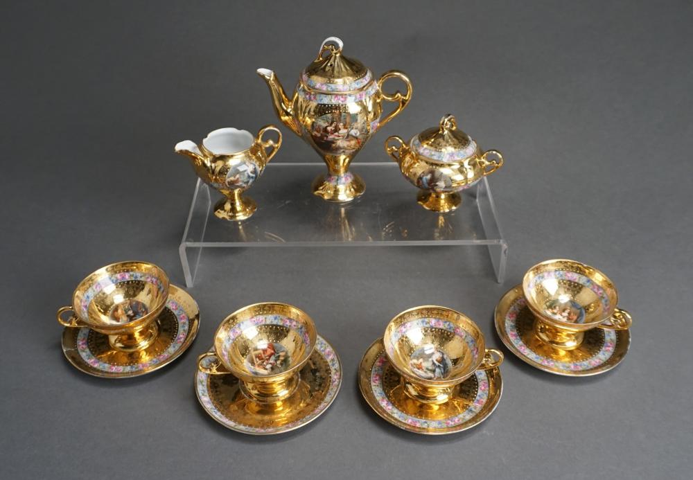 GILT AND FLORAL DECORATED TEA SET, 11