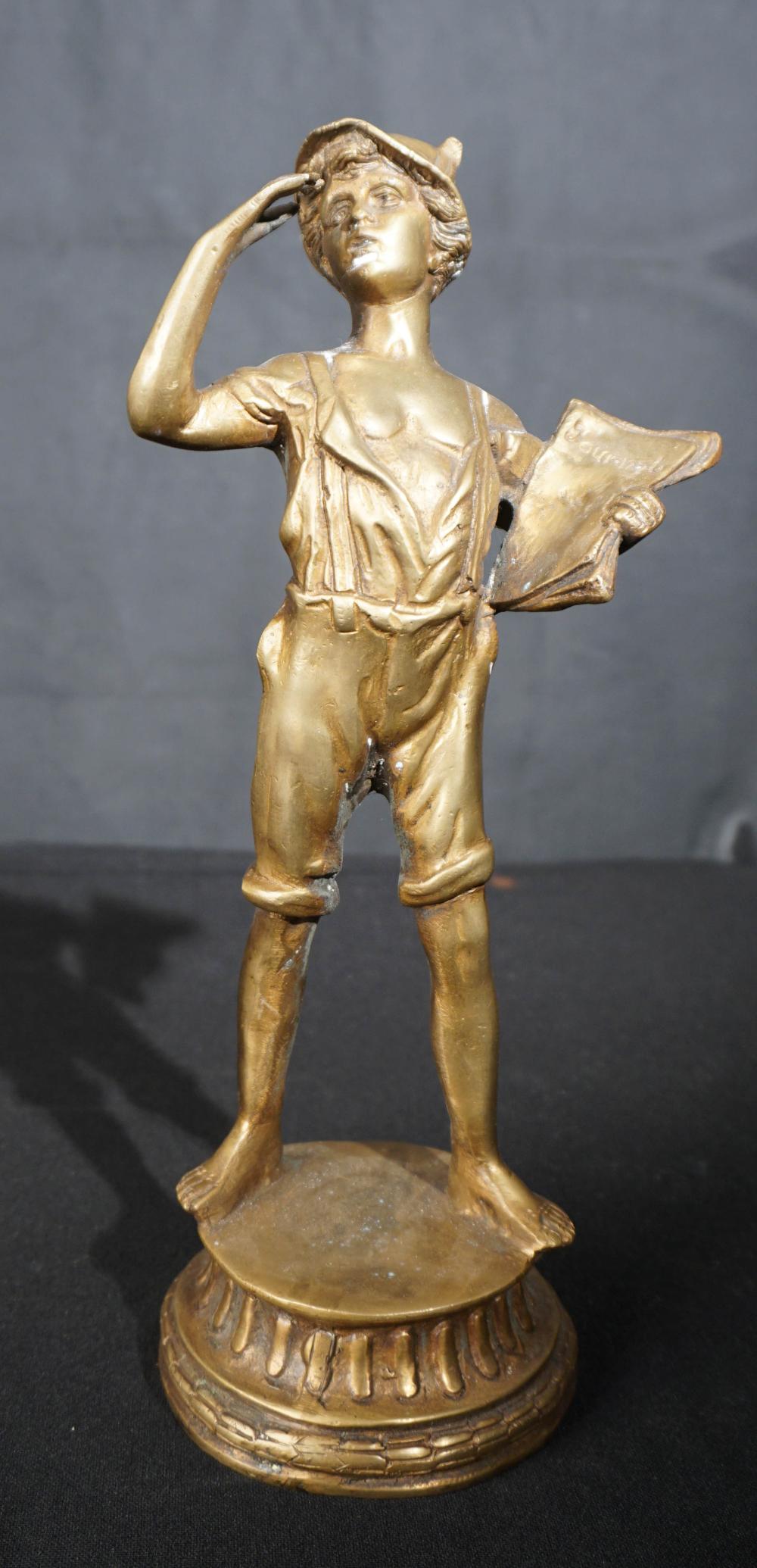 BRONZE FIGURE OF A JOURNAL SALESMAN