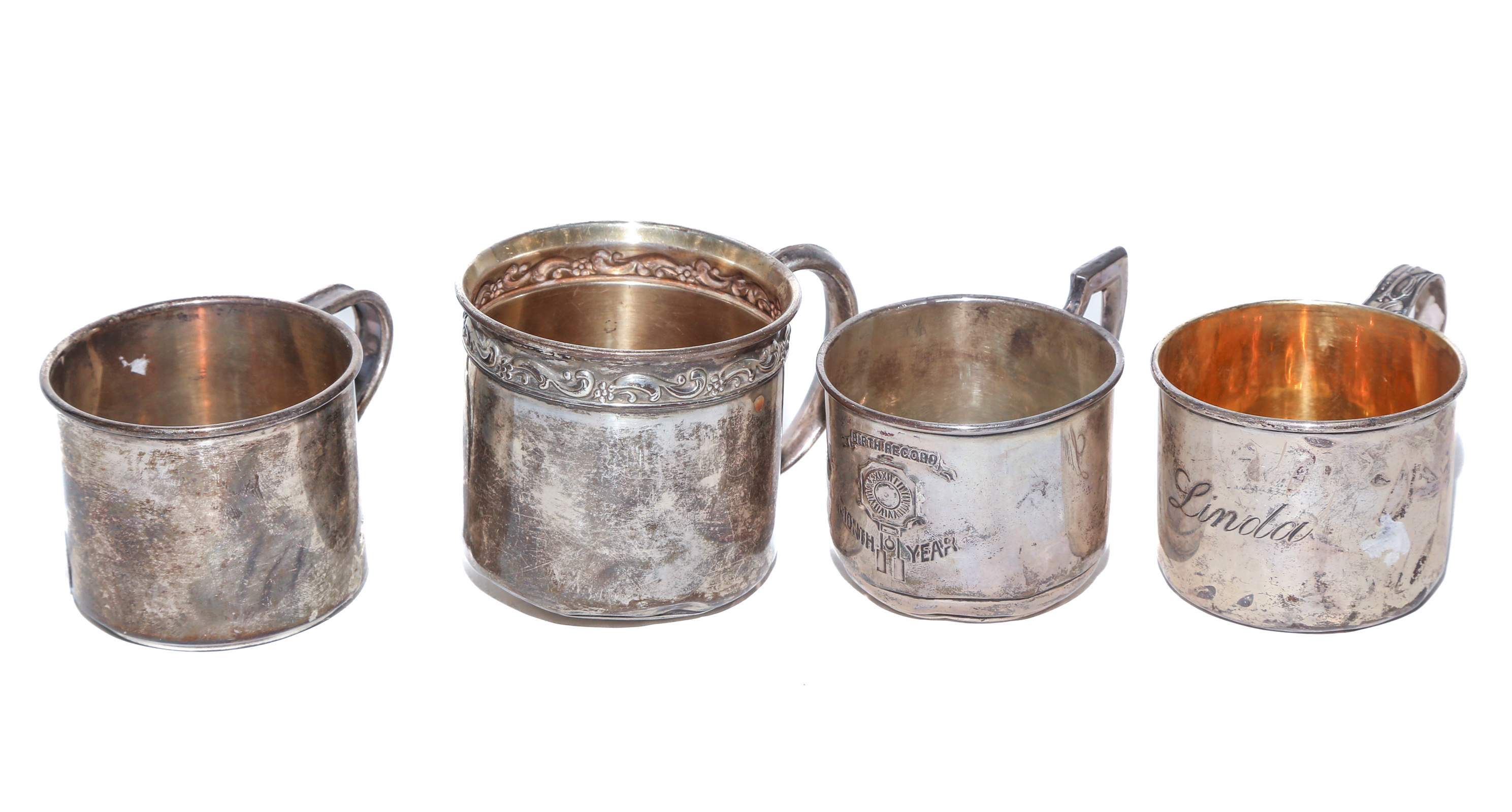 FOUR STERLING BABY CUPS Including