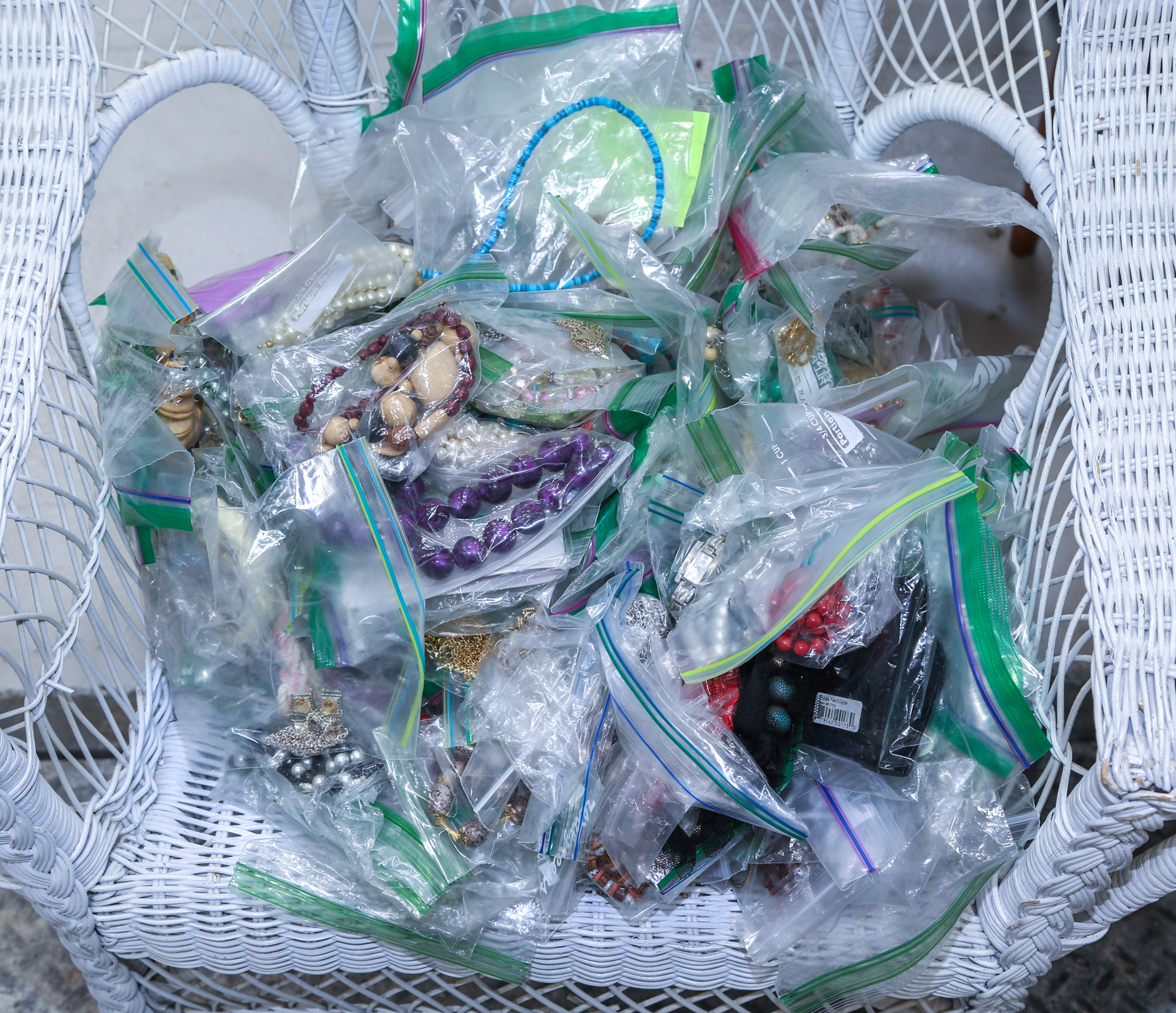 A LARGE BAGGED LOT OF COSTUME JEWELRY