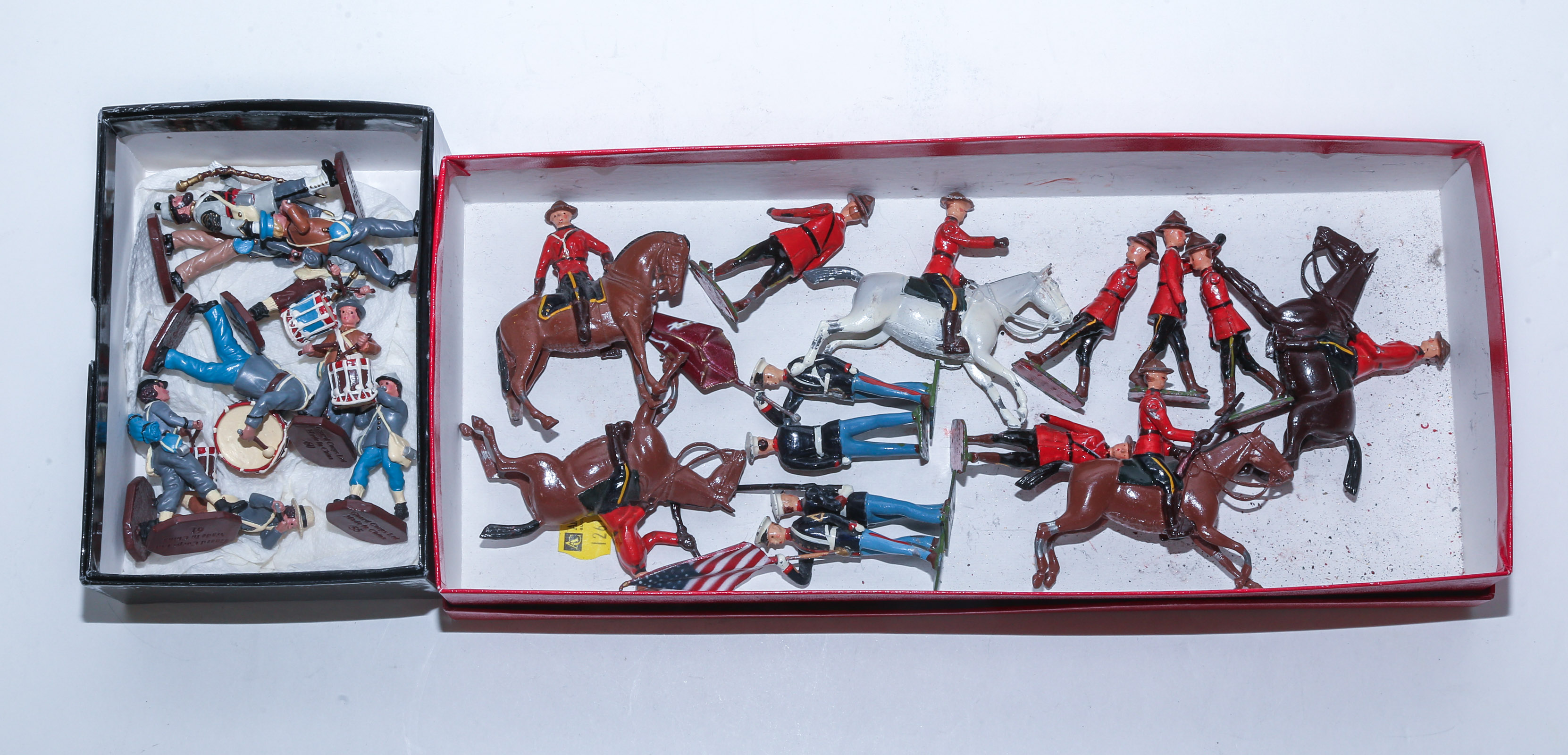 BOX OF BRITAINS LEAD SOLDIERS With two