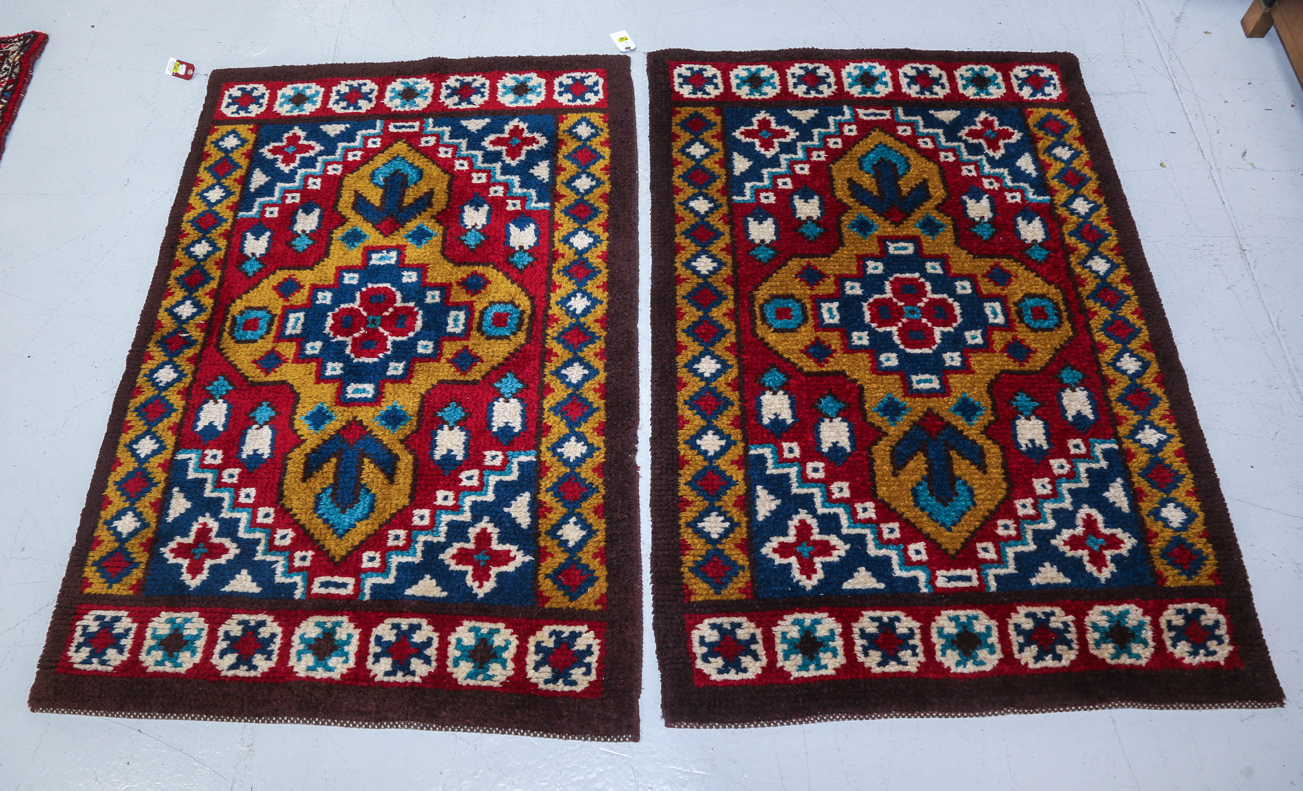 A PAIR OF MOROCCAN STYLE RUGS,