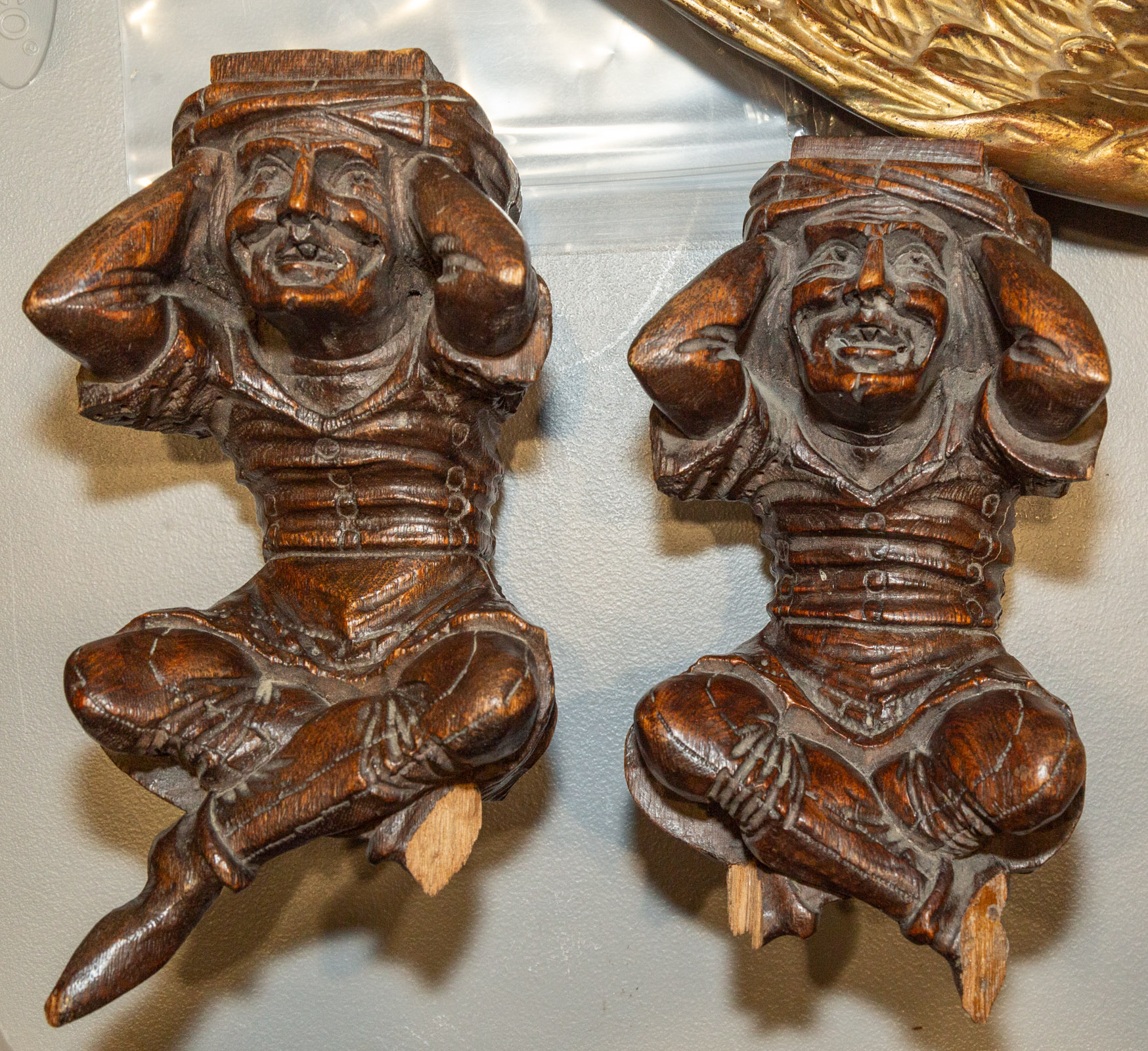 A PAIR OF CARVED WOOD FIGURAL SUPPORTS