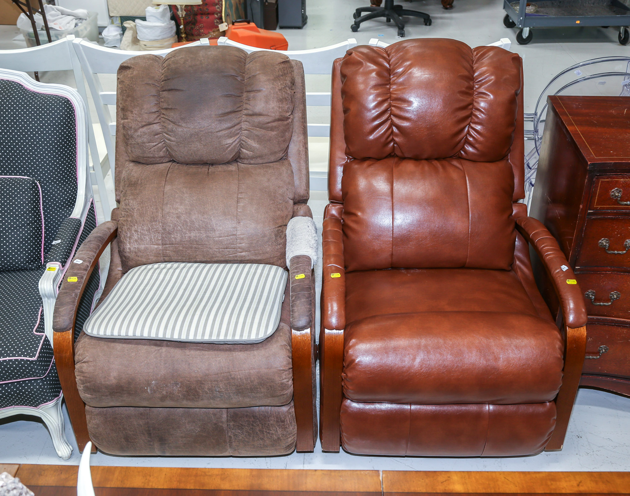 TWO LEATHER-UPHOLSTERED RECLINING