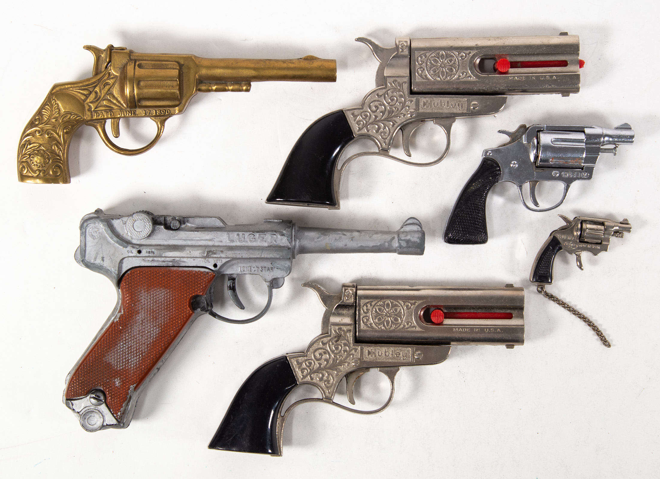 GROUPING OF SIX TOY PISTOLS Includes