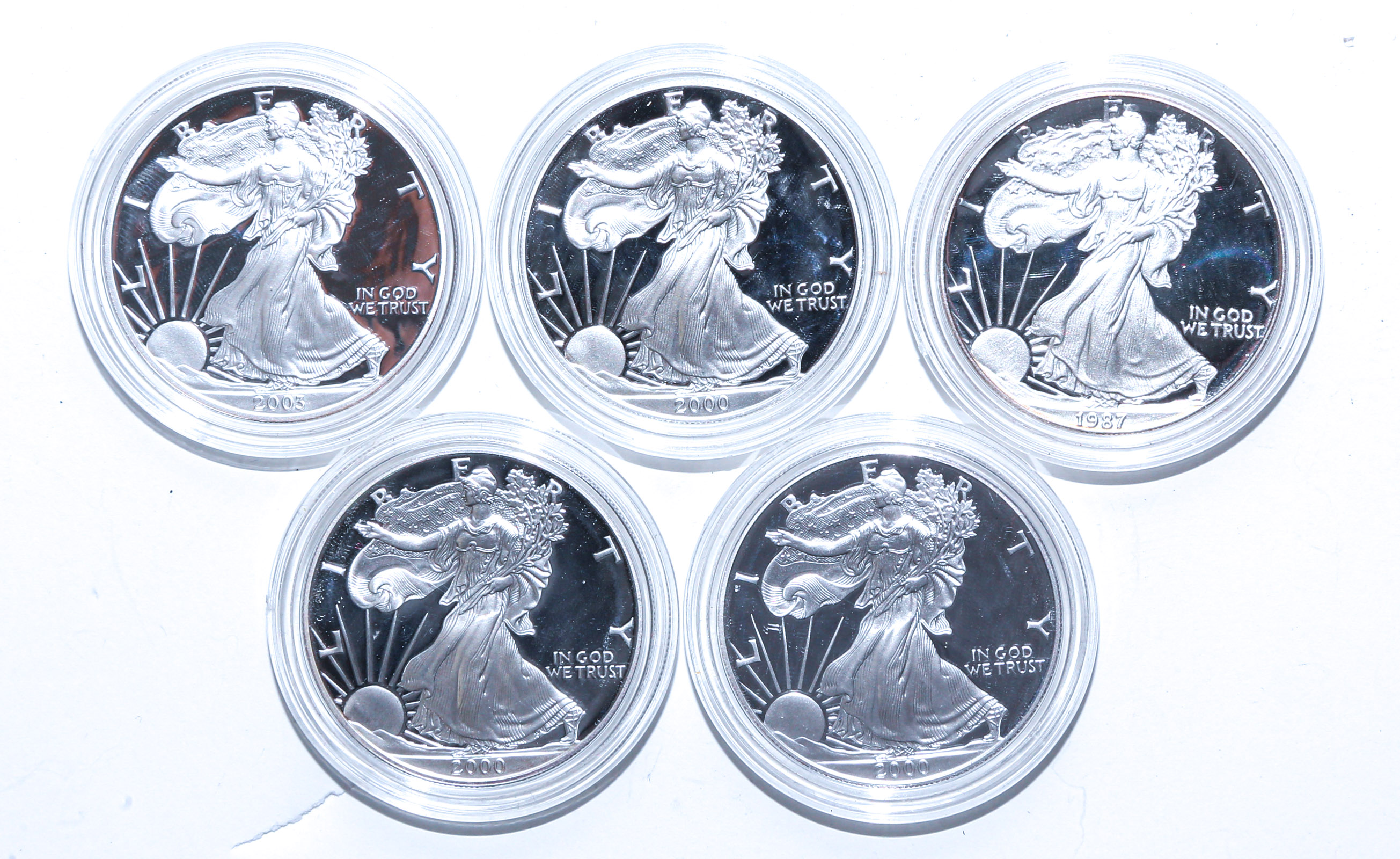 FIVE PROOF SILVER EAGLES IN MINT