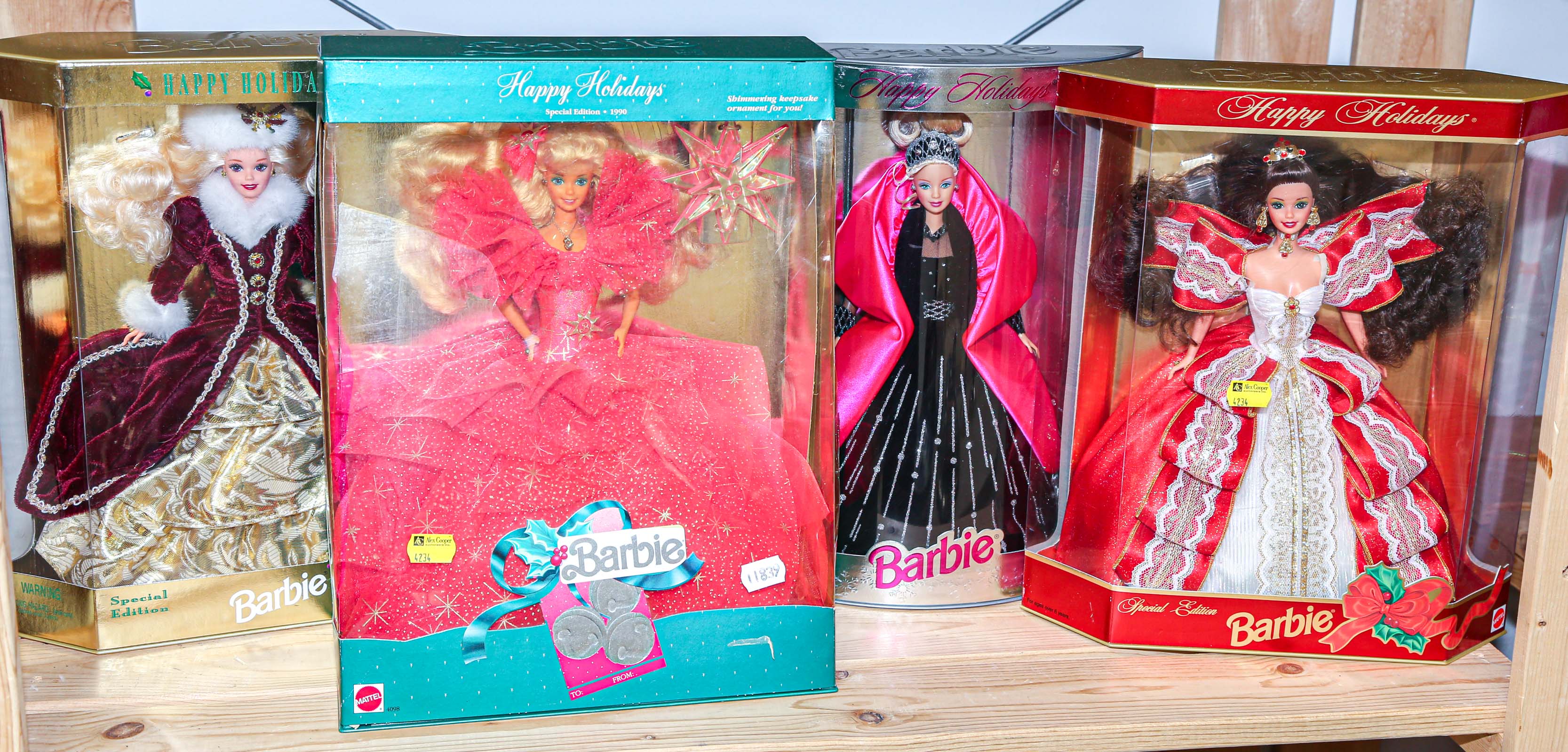 FOUR BOXED HAPPY HOLIDAY BARBIES