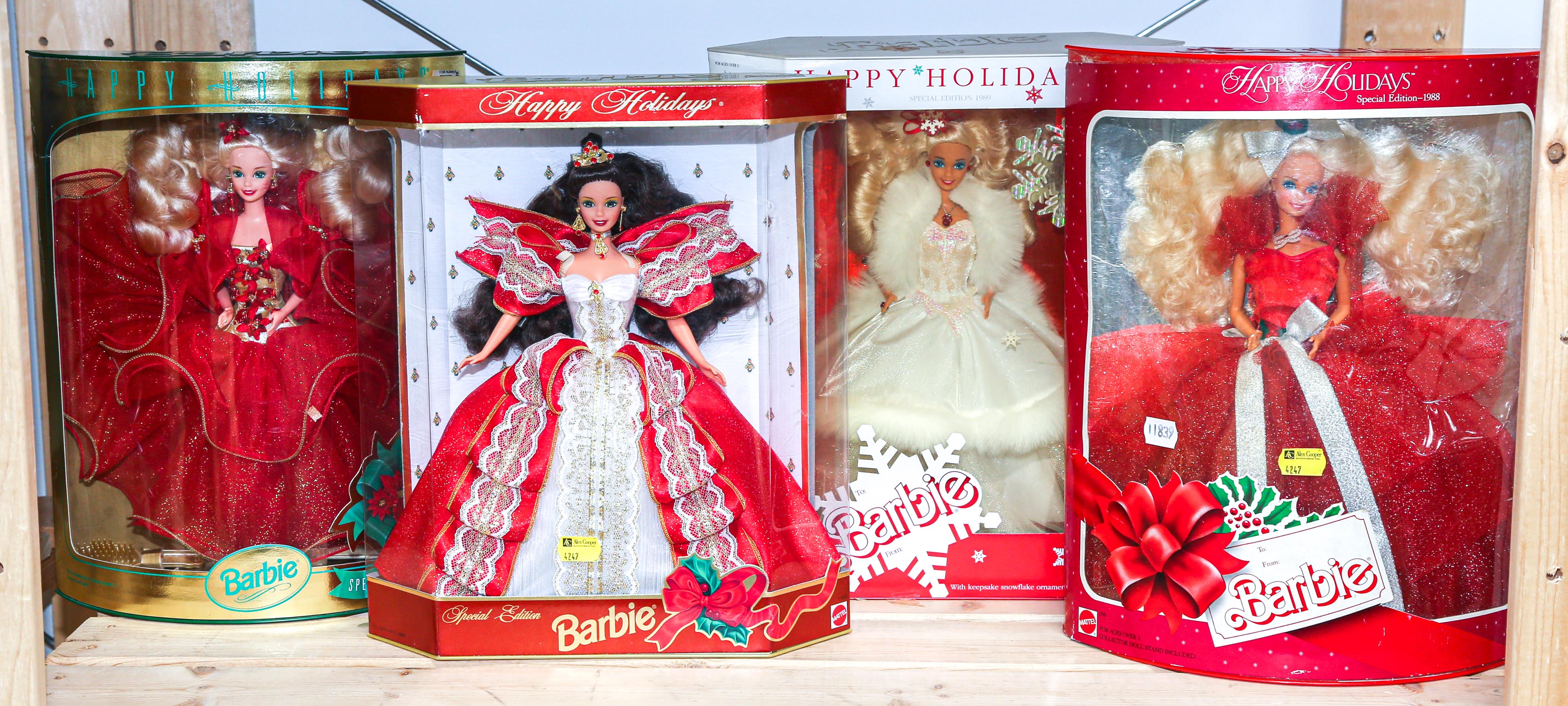 FOUR BOXED HAPPY HOLIDAY BARBIES