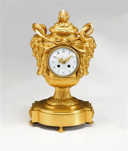 Louis XVI style gilt-bronze mantel clock
