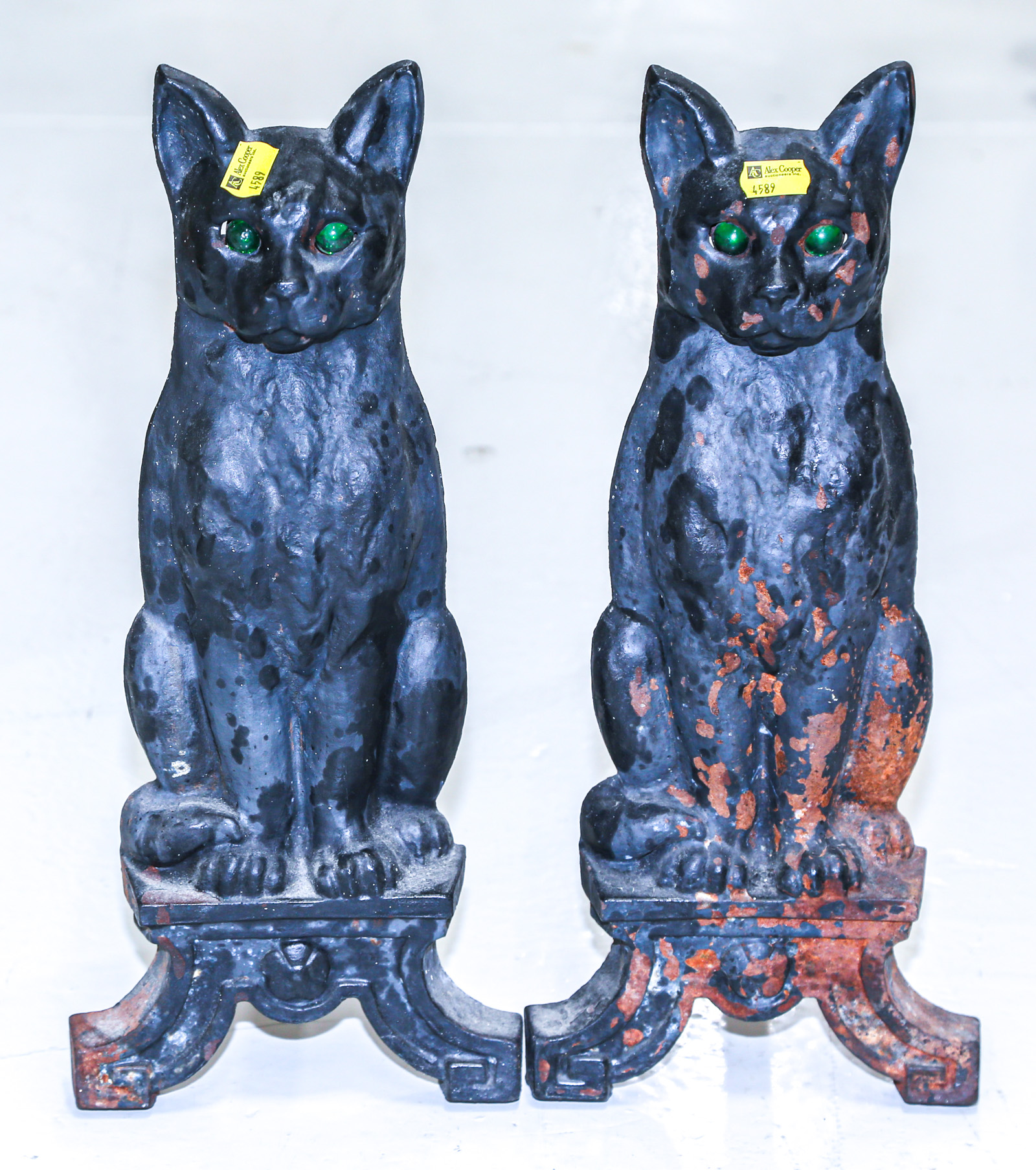 A PAIR OF CAST IRON CAT FORM ANDIRONS