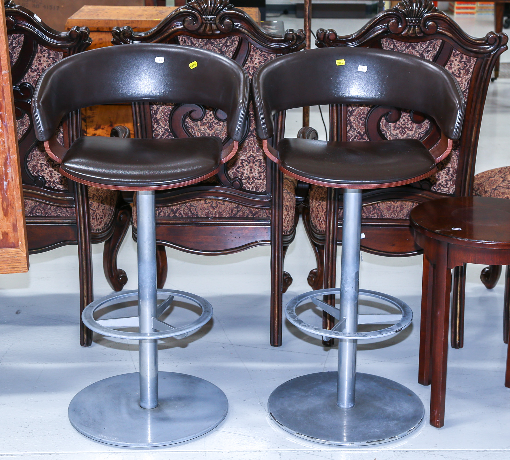 TWO ALLERMUIR ROTATING BAR STOOLS