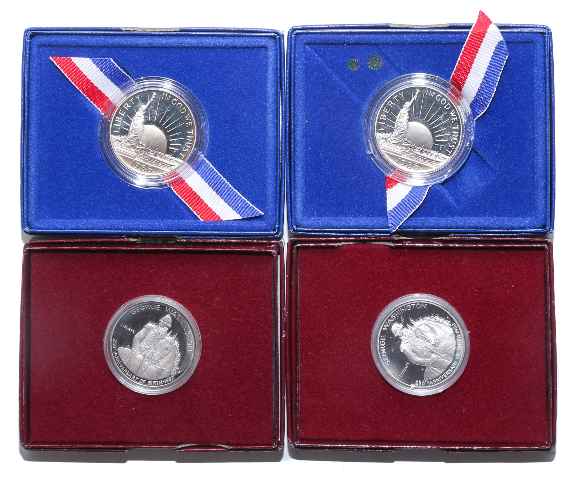 FOUR COMMEMORATIVE HALF DOLLARS 1982-1986