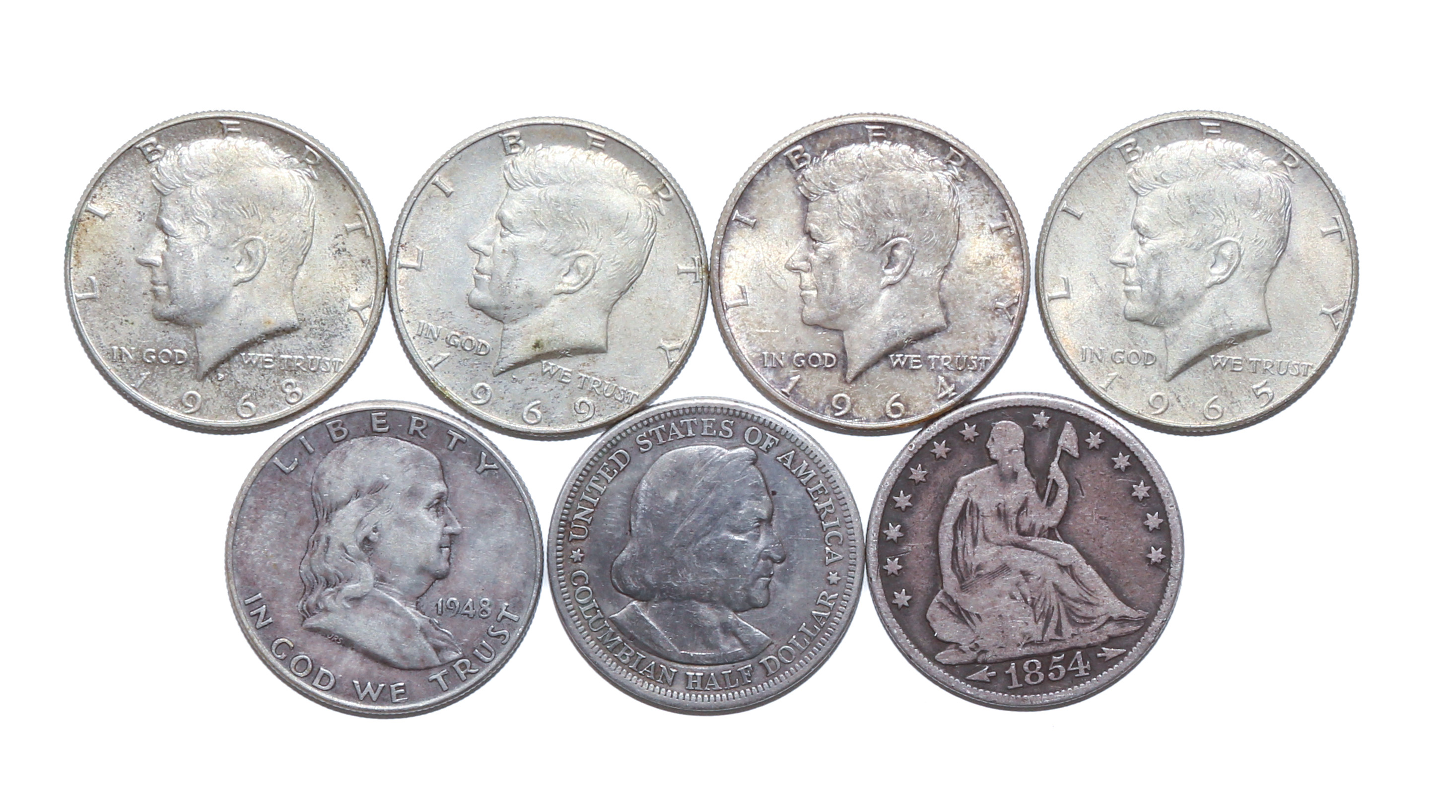 SEVEN HALF DOLLARS INCLUDING 1854-O