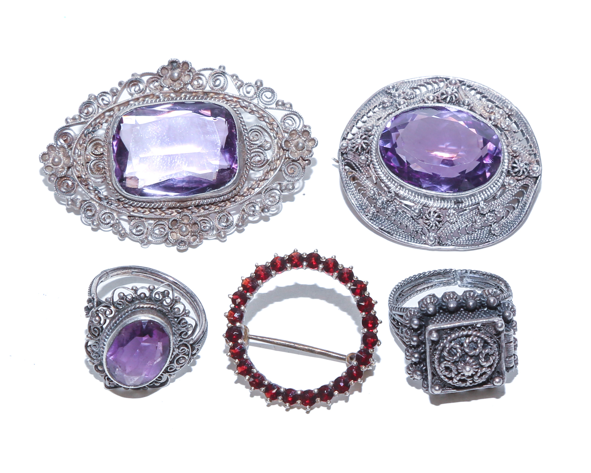 A GROUP OF AMETHYST & SILVER BROOCHES