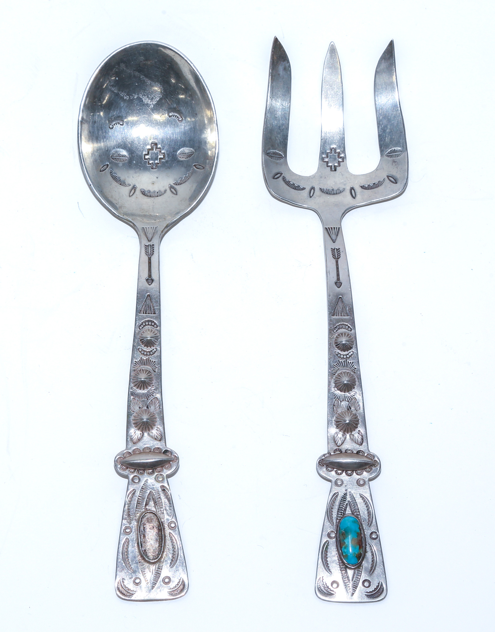 A PAIR OF NAVAJO STERLING SALAD