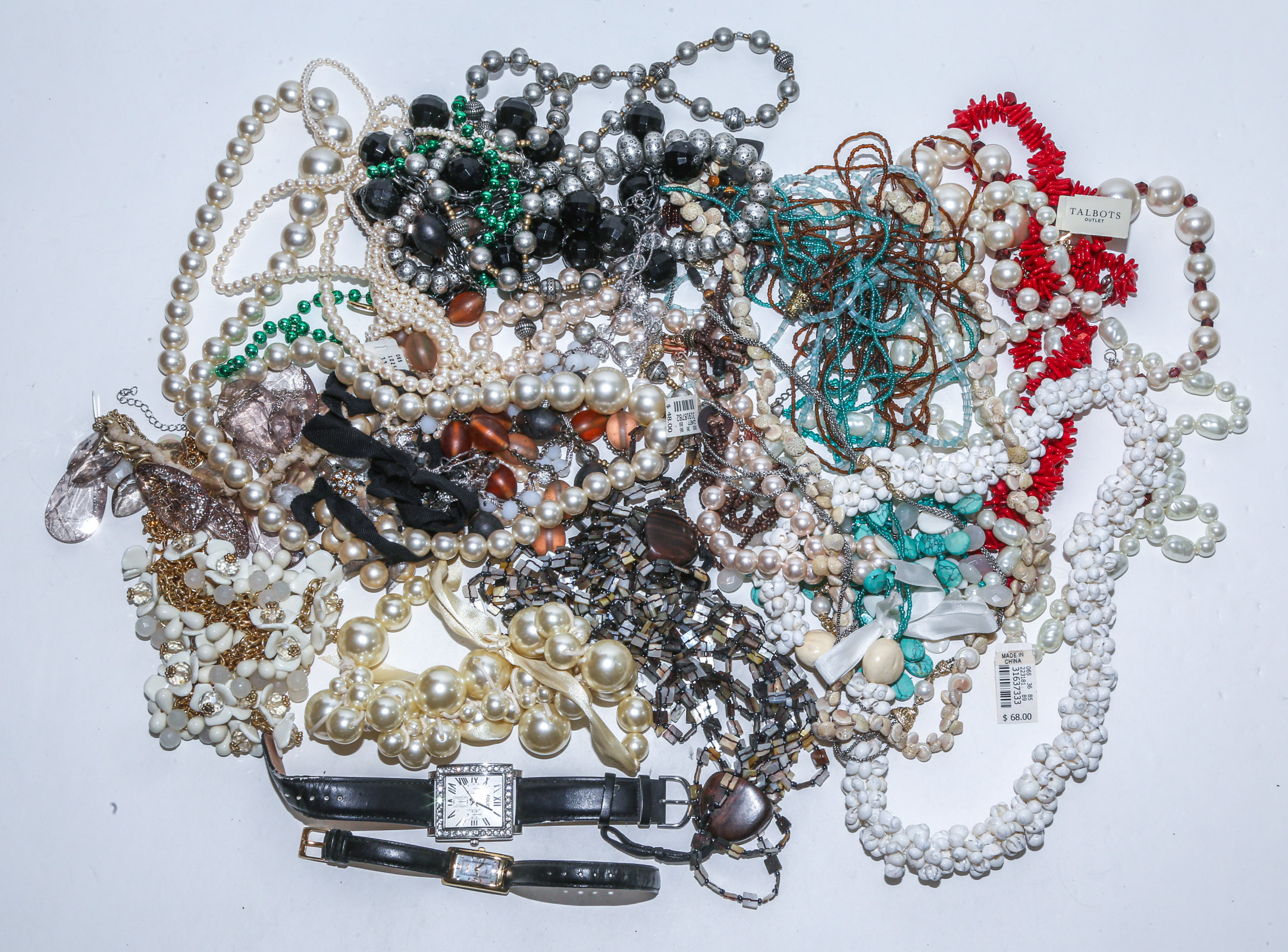 A LARGE COLLECTION OF BEADED NECKLACES