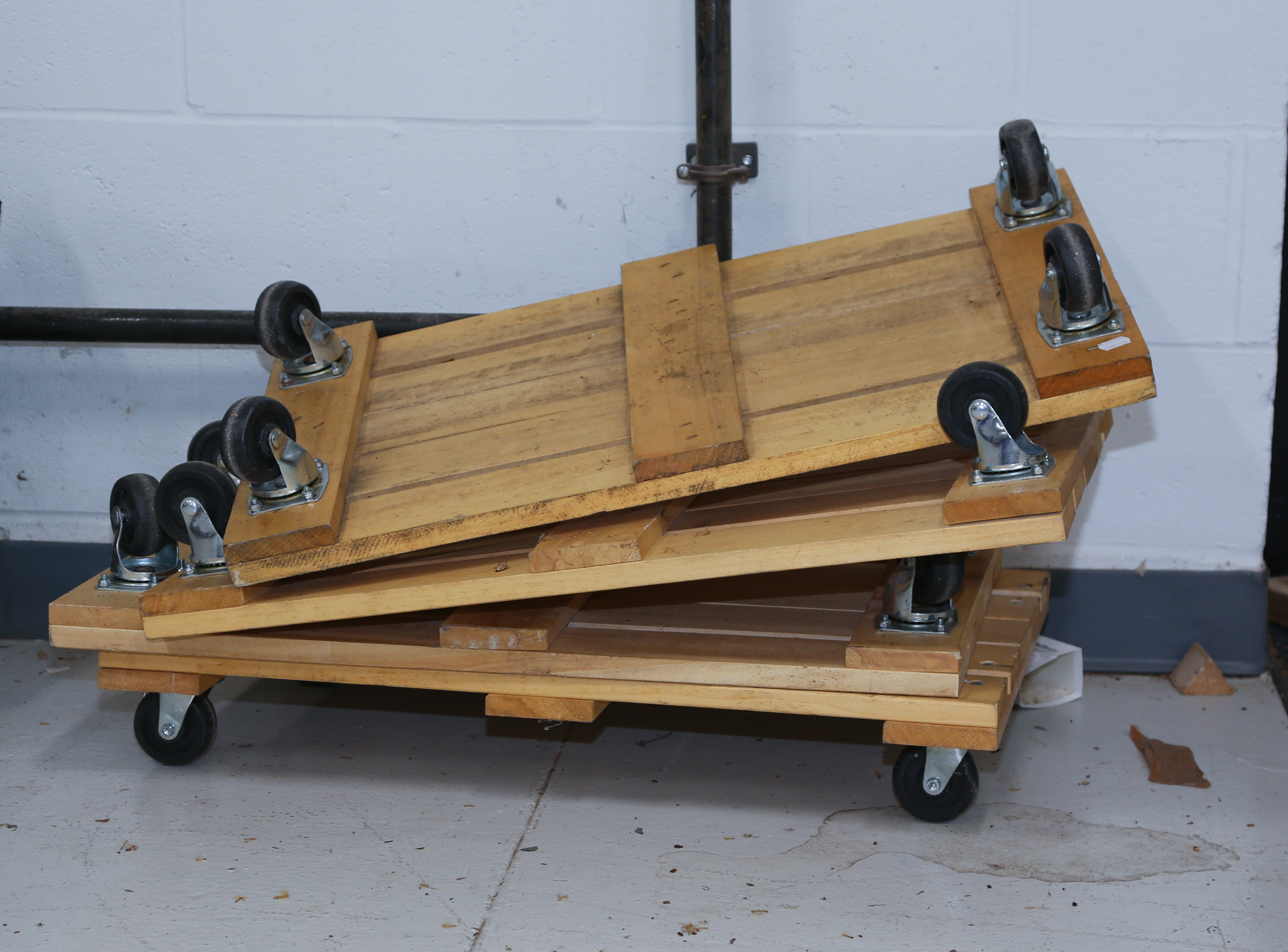 FOUR WOOD PLANK FURNITURE DOLLIES