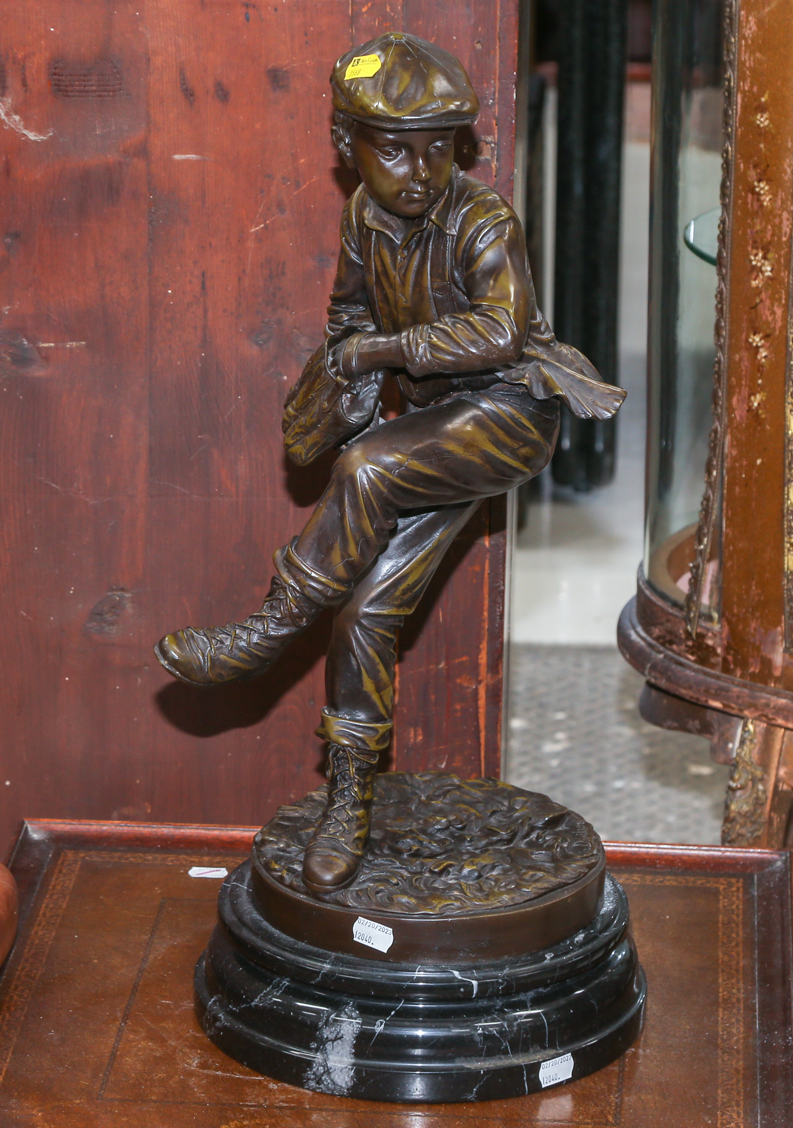 PATINATED BRONZE FIGURE OF A YOUNG BASEBALL