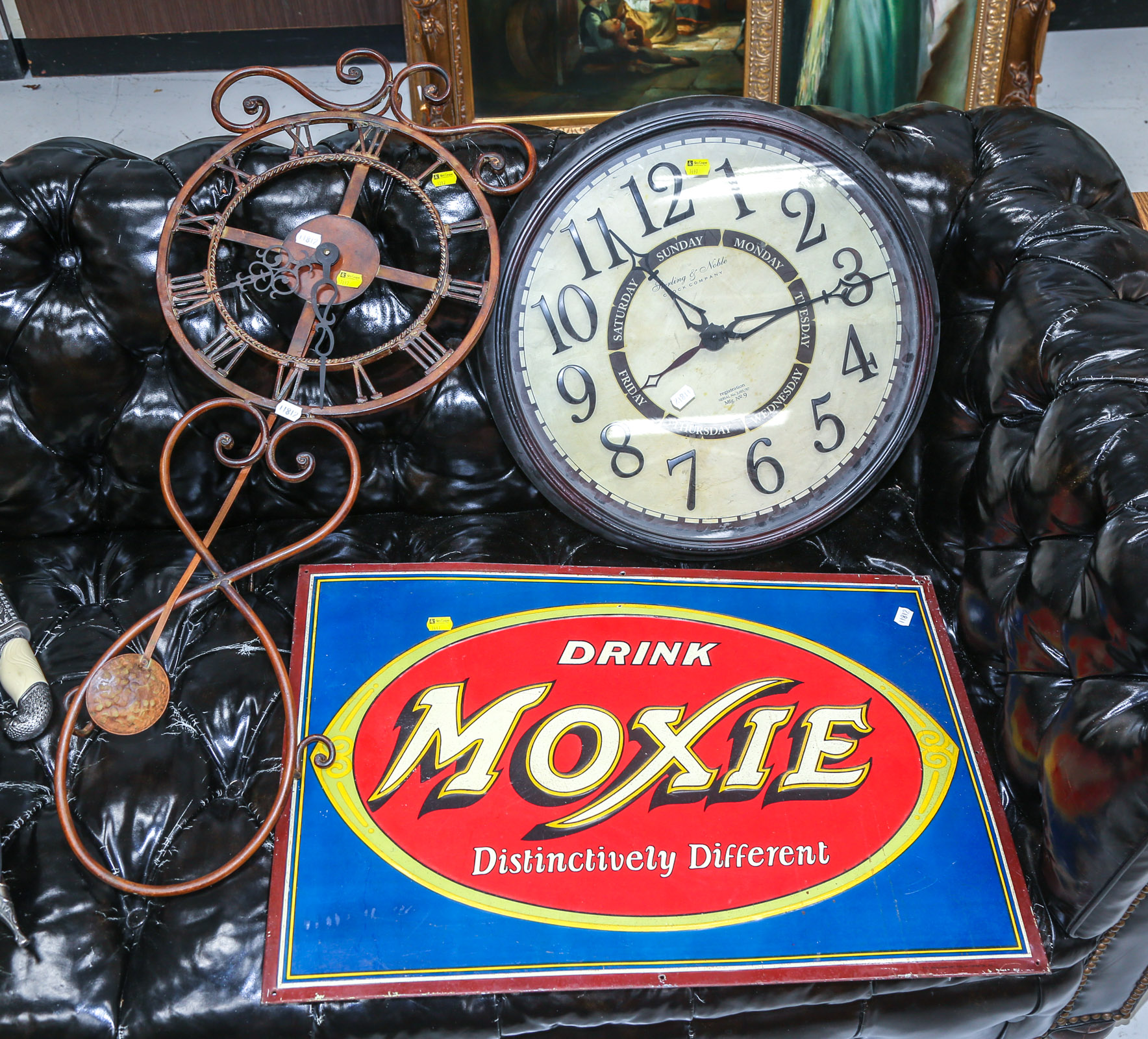 TWO CLOCKS & AN ADVERTISING SIGN