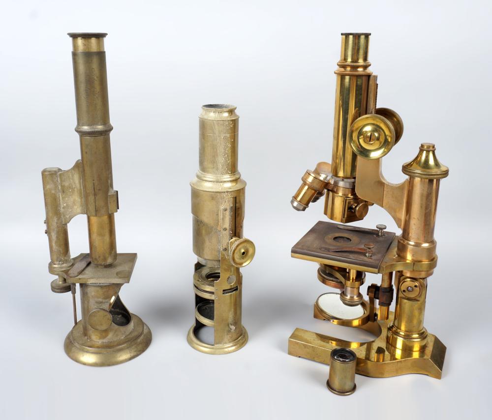 TWO BRASS MICROSCOPES AND AN E.
