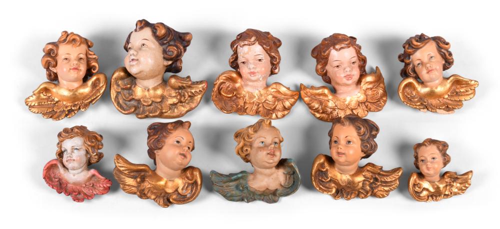 GROUP OF NINE PAINTED RESIN WINGED 2ec476