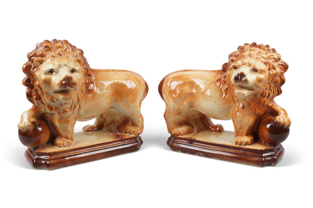PAIR OF STAFFORDSHIRE LIONS, 20TH