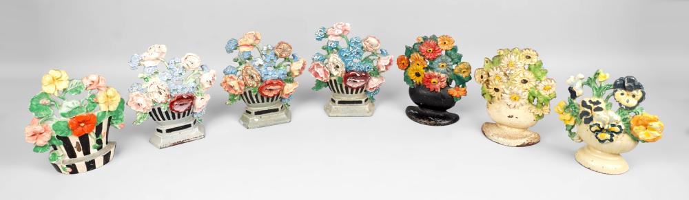 THREE PAIRS OF FLOWER CAST IRON