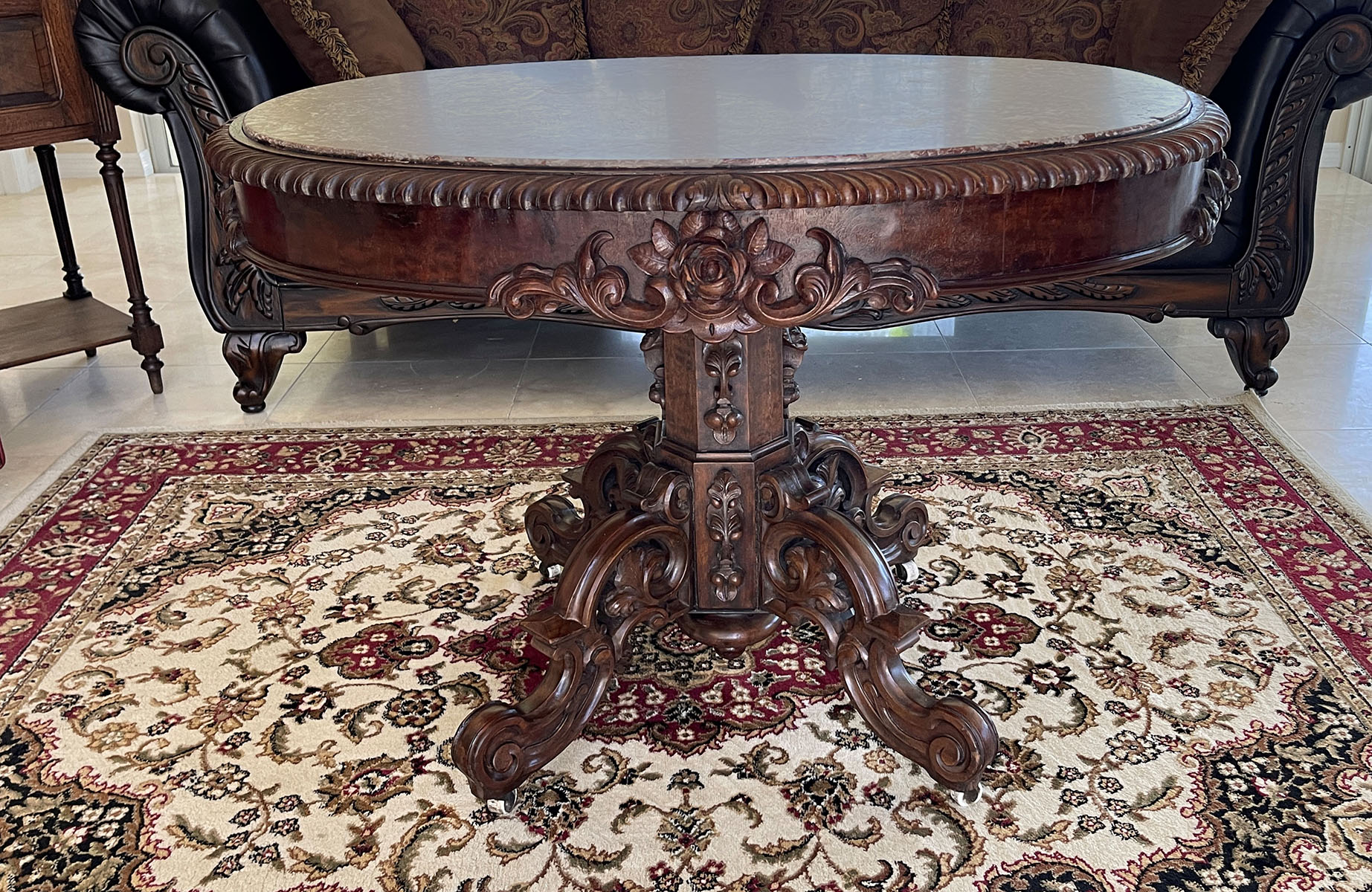 PROFUSELY CARVED OVAL MARBLE TOP