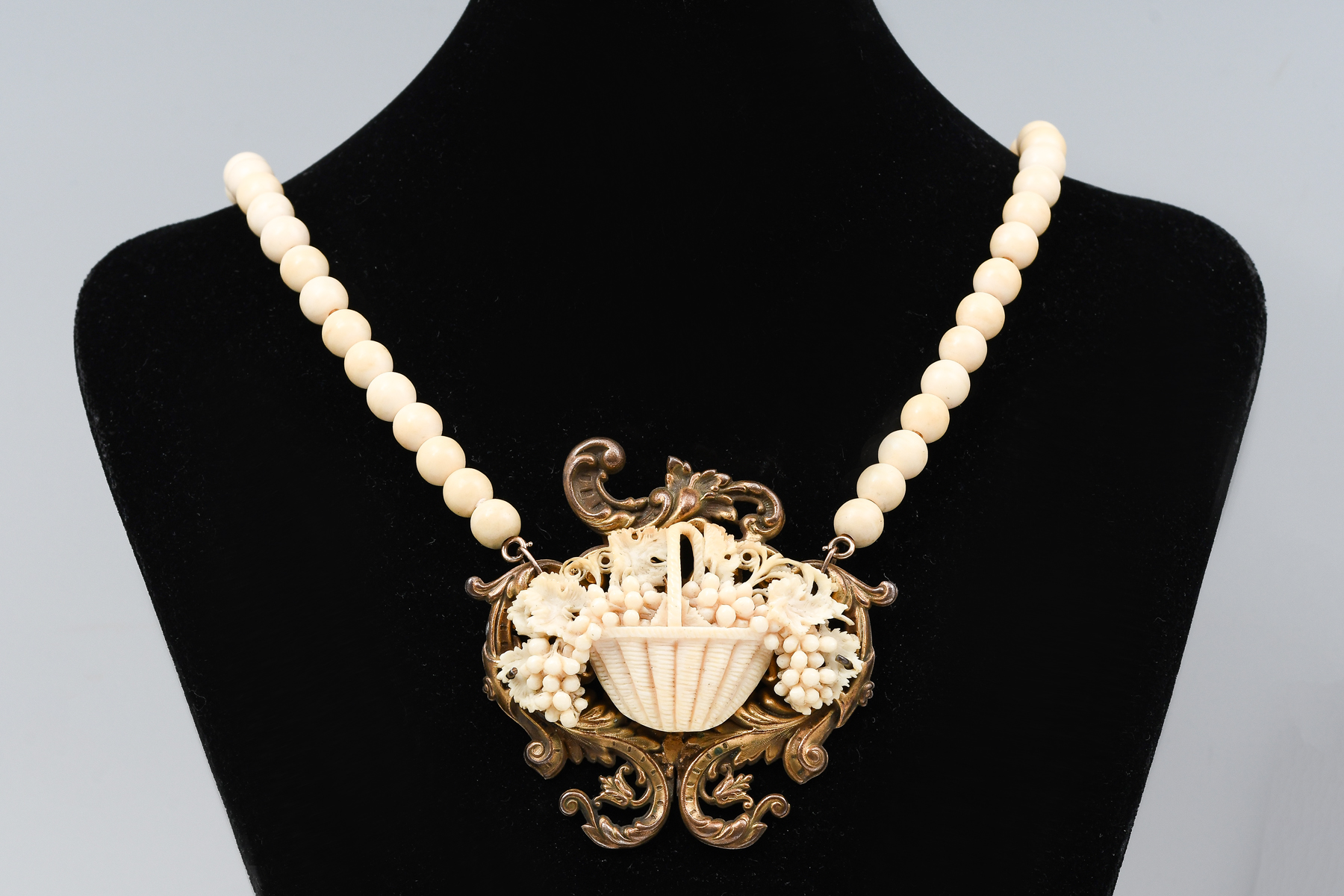 CARVED IVORY? NECKLACE: Beaded necklace