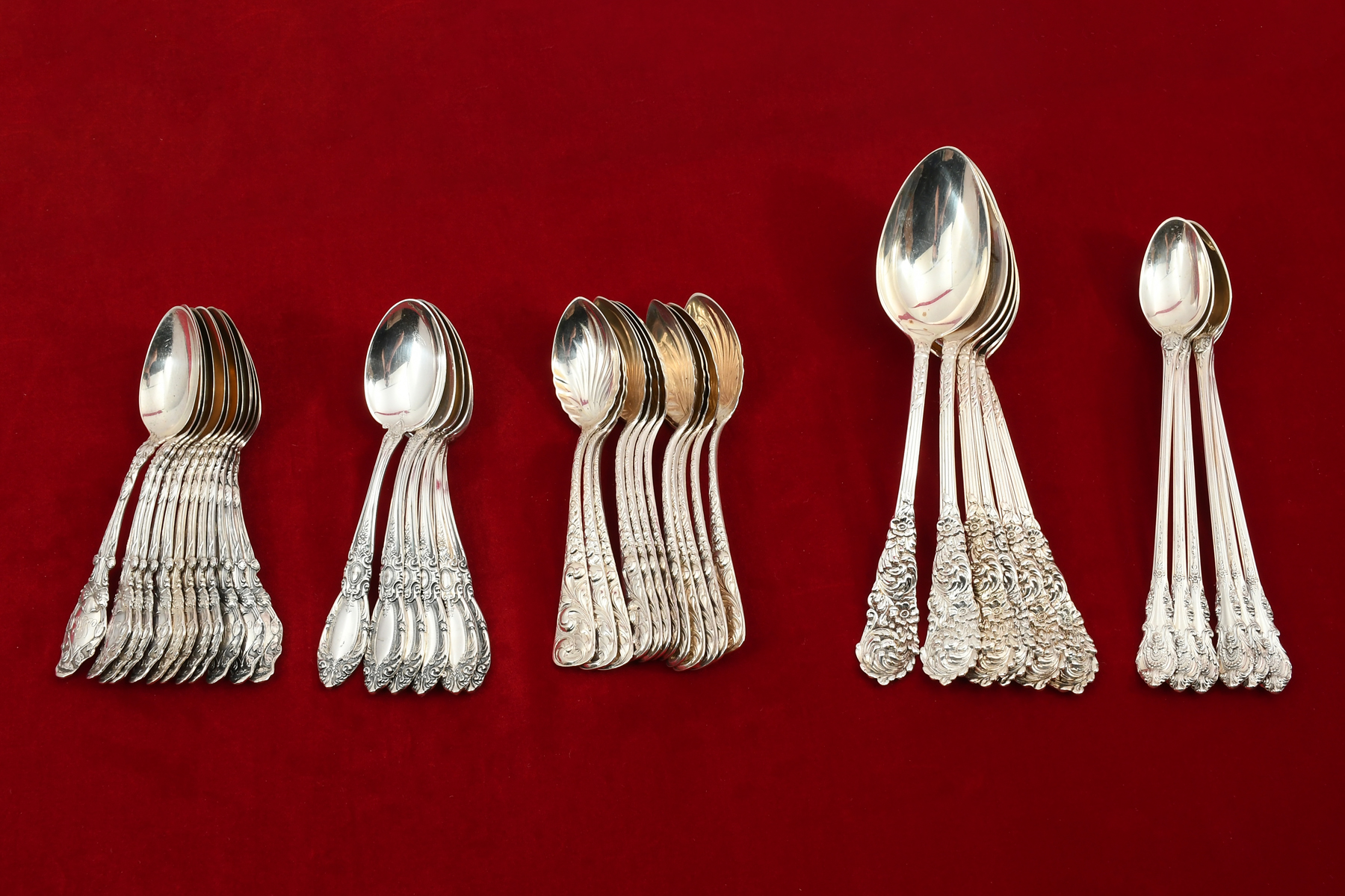 5 SETS OF ORNATE STERLING SPOONS: