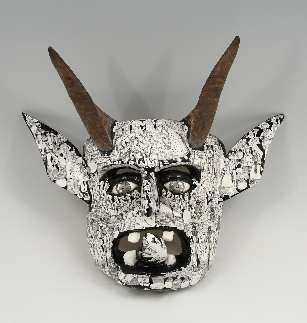 CARVED AND PAINTED GROTESQUE MASK