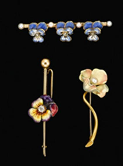 Group of three gold and enamel flower