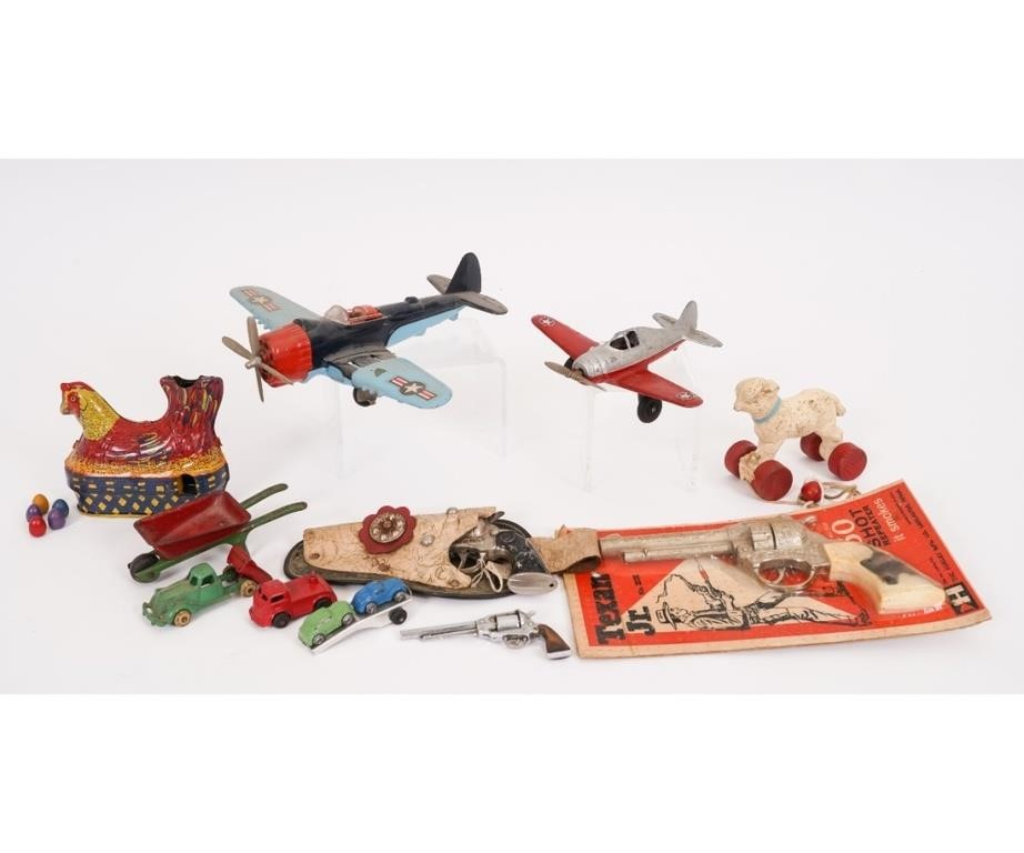 Hubley airplanes and six-shooter toy