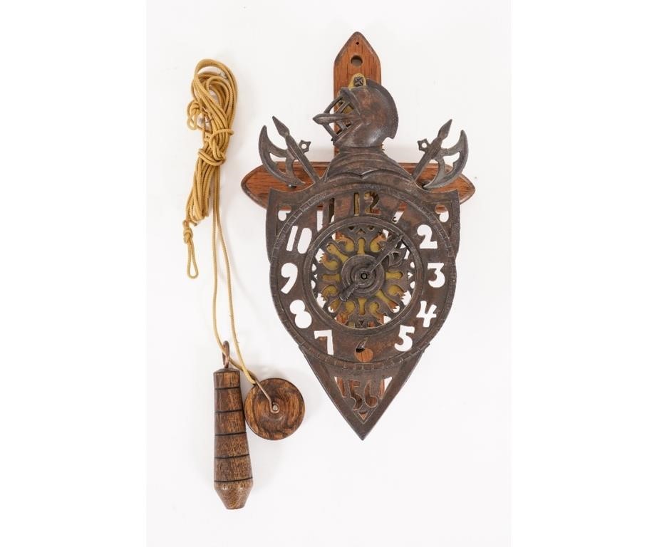 Medieval style iron face wall clock